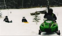 Family Fun time at Harris Hill Resort: Enjoy snowmobiling, sight seeing and ice fishing too on your family winter vacation.
